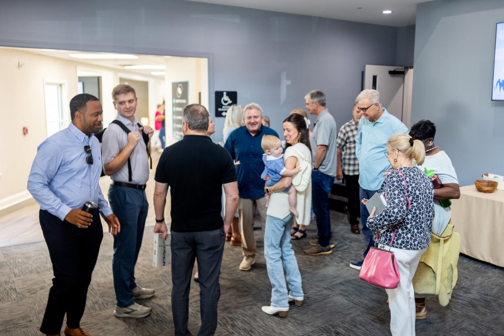 Members of East Cobb Church of Christ visiting together in the foyer after service