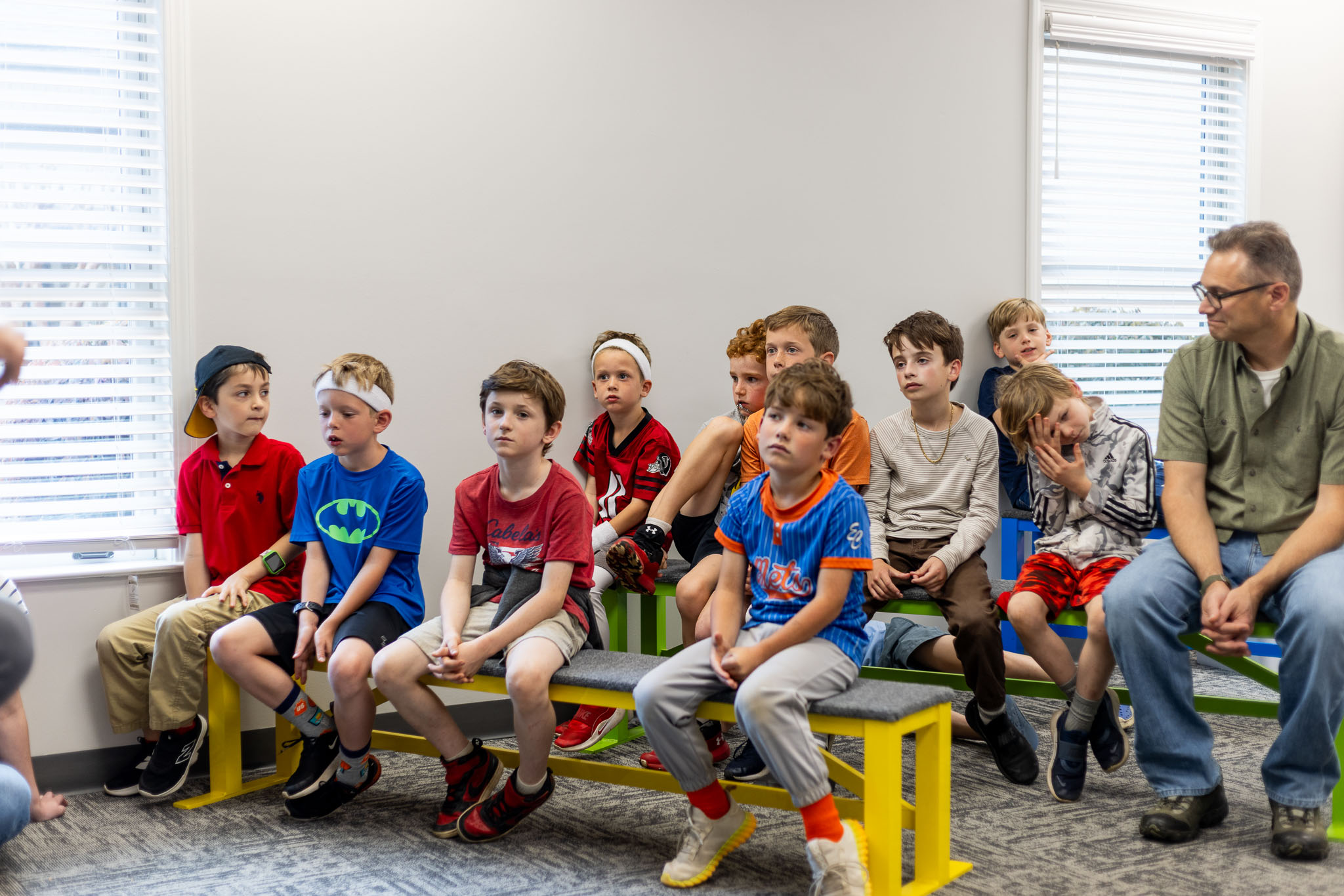 A small group leader working through a lesson with kids at a table