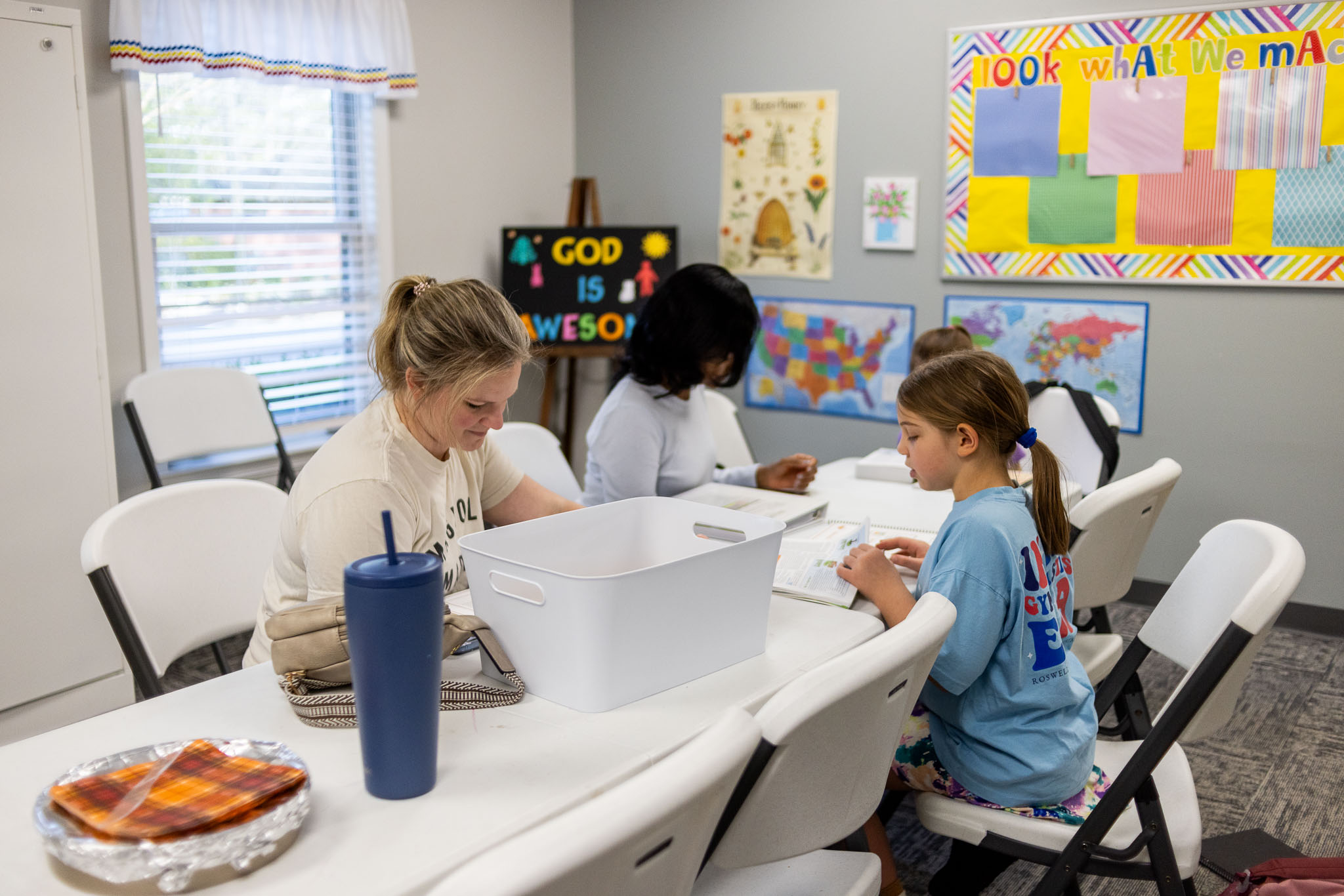 Kids enjoying games and snacks together at Navigators