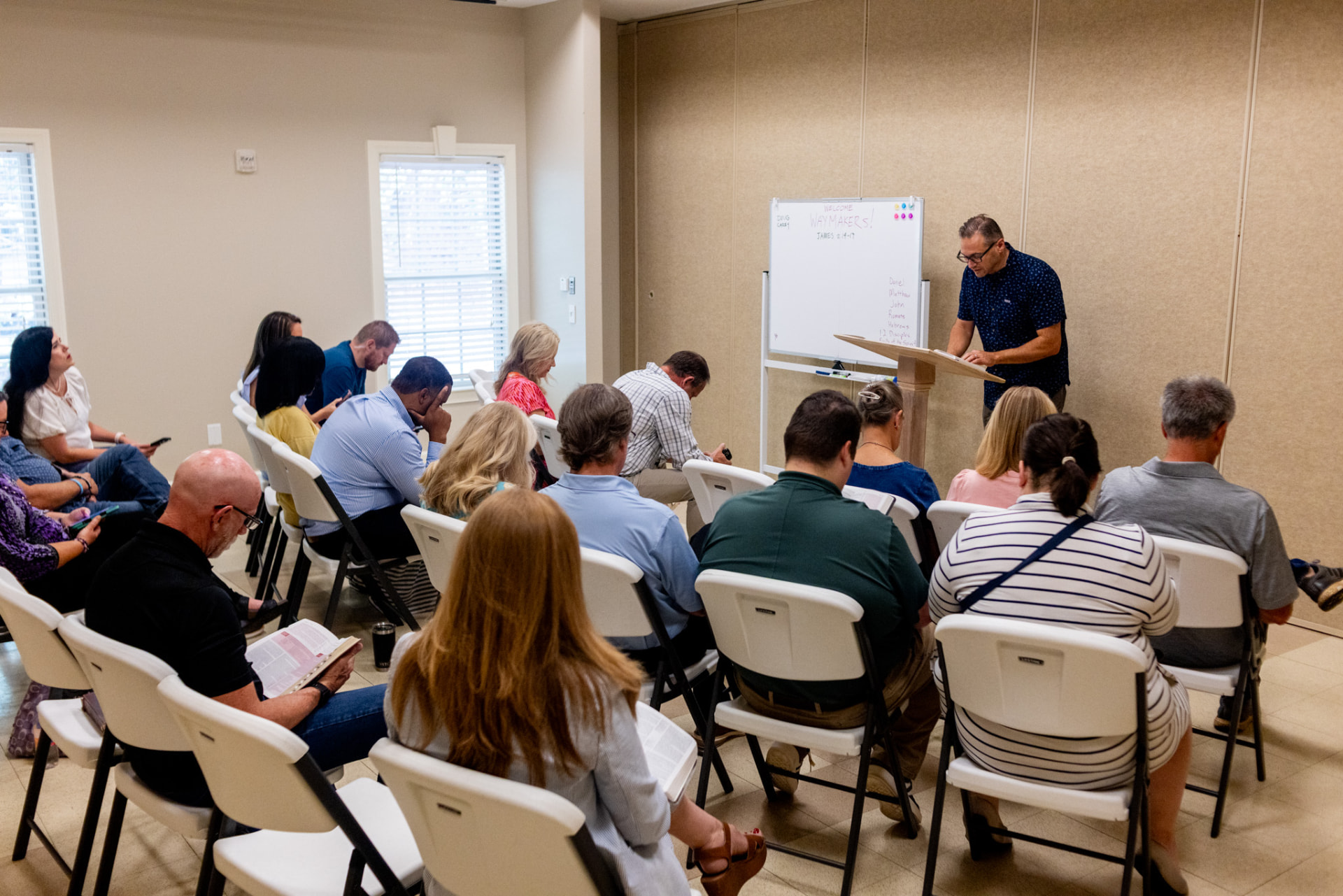 A small group of adults studying scripture together in a circle
