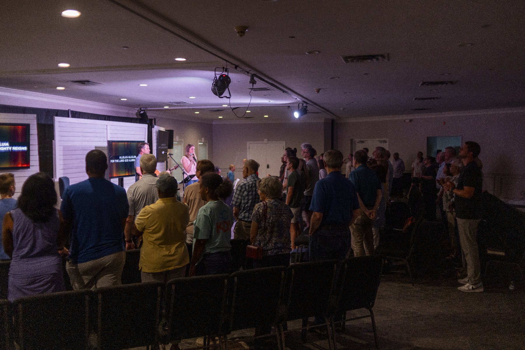 Church members greeting one another after worship